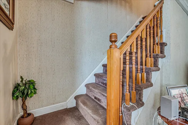 a view of entryway with wooden floor and bedroom view