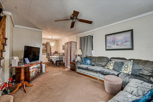 a view of a livingroom with furniture and toys