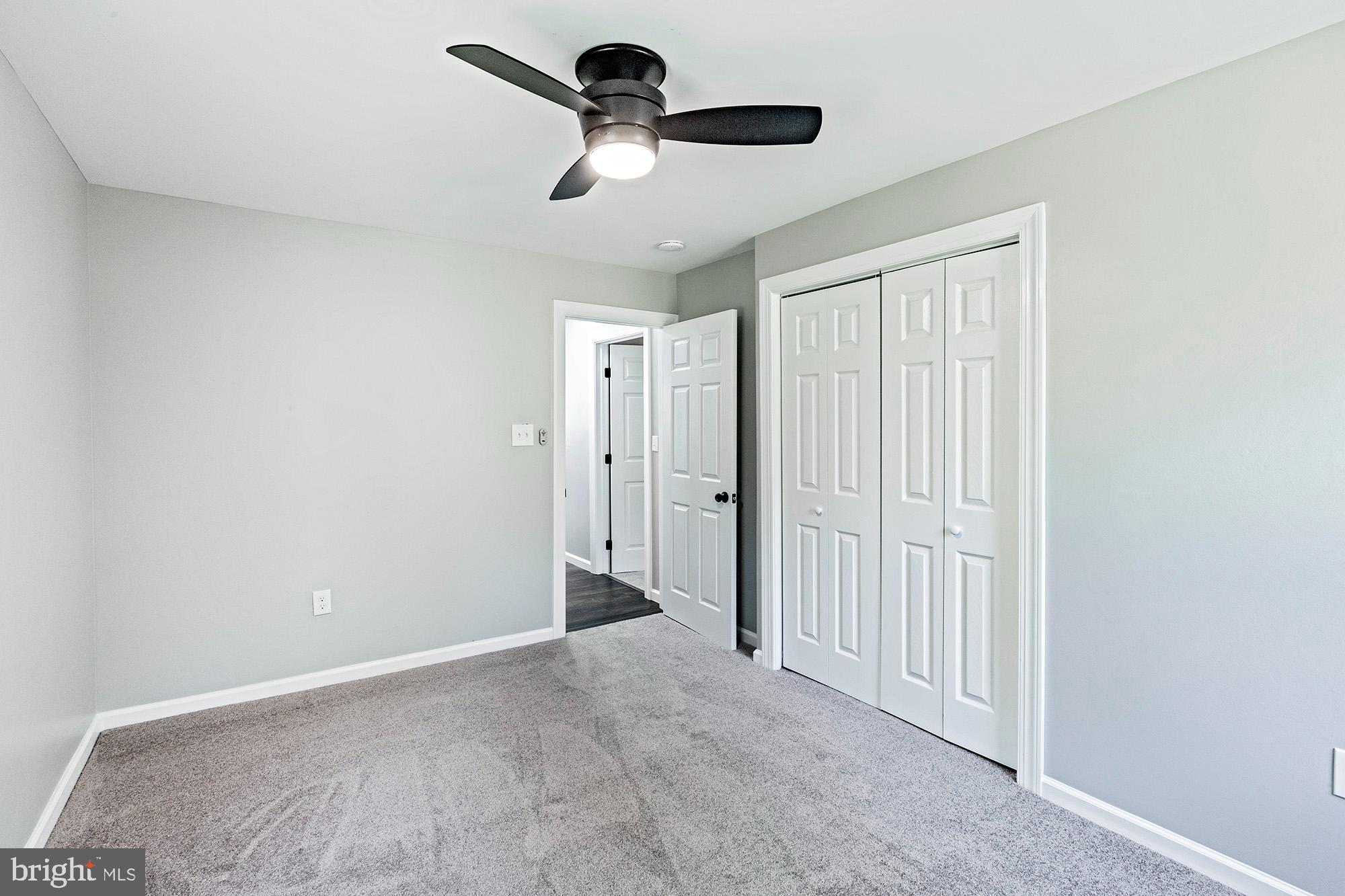 78 North Hook Road Pennsville, NJ 08070 - Photo 15 of 26 a view of a livingroom with a ceiling fan and window
