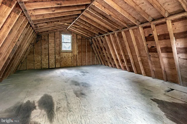 a view of a room with wooden walls