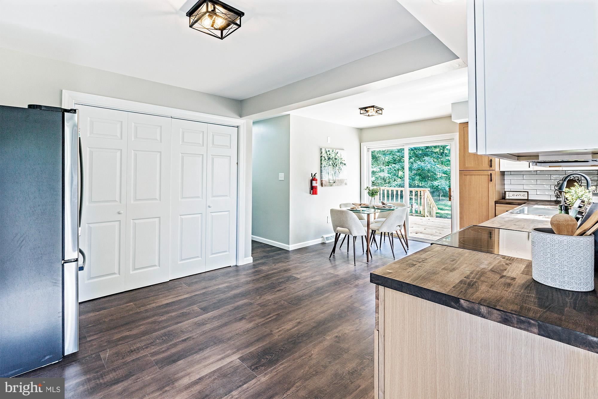 78 North Hook Road Pennsville, NJ 08070 - Photo 6 of 26 a view of a dining room with furniture a chandelier and wooden floor
