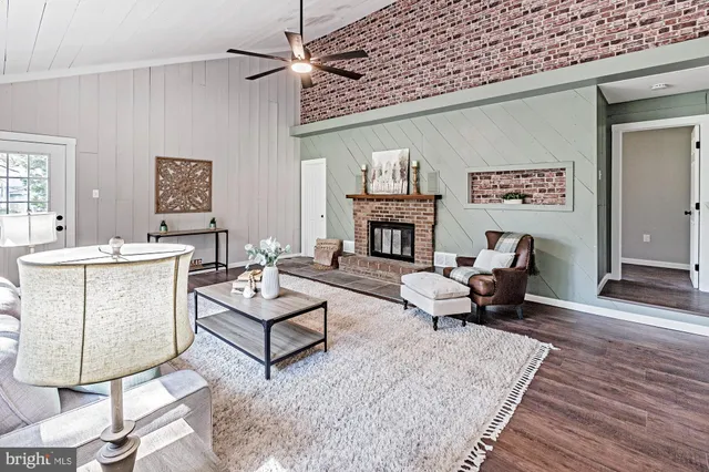 a living room with furniture and a fireplace