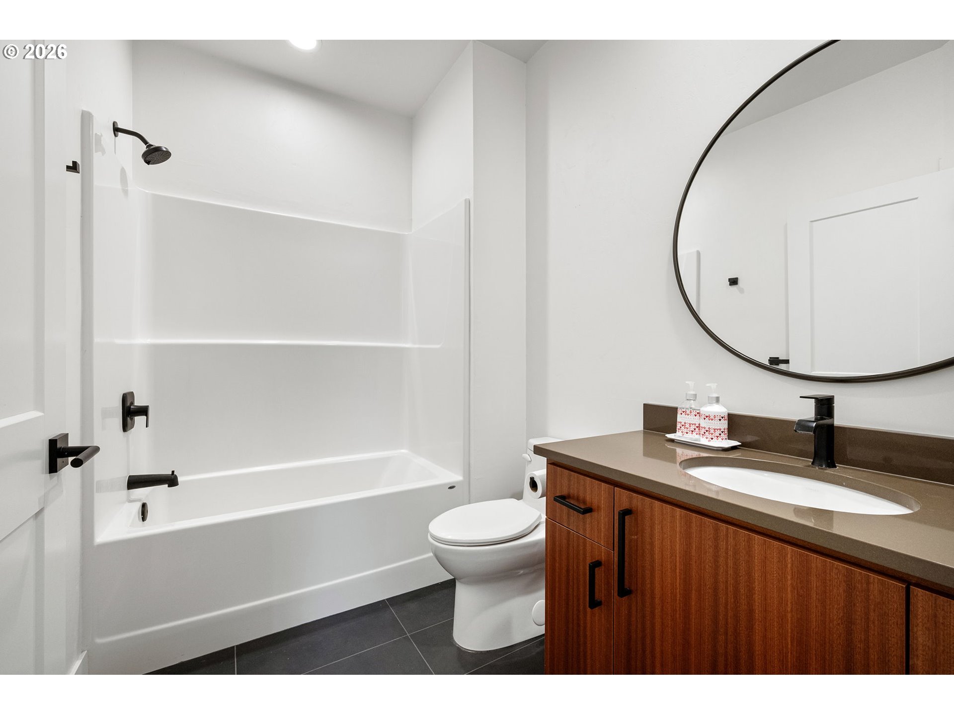 3340 Zane Lane Eugene, OR 97404 - Photo 11 of 37 a bathroom with a sink a toilet and a mirror