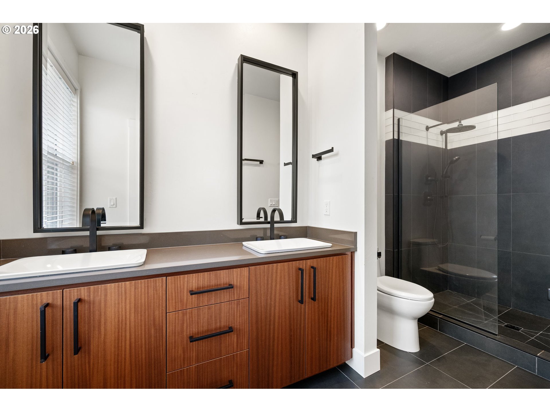 3340 Zane Lane Eugene, OR 97404 - Photo 15 of 37 a bathroom with a granite countertop sink a toilet a mirror and shower