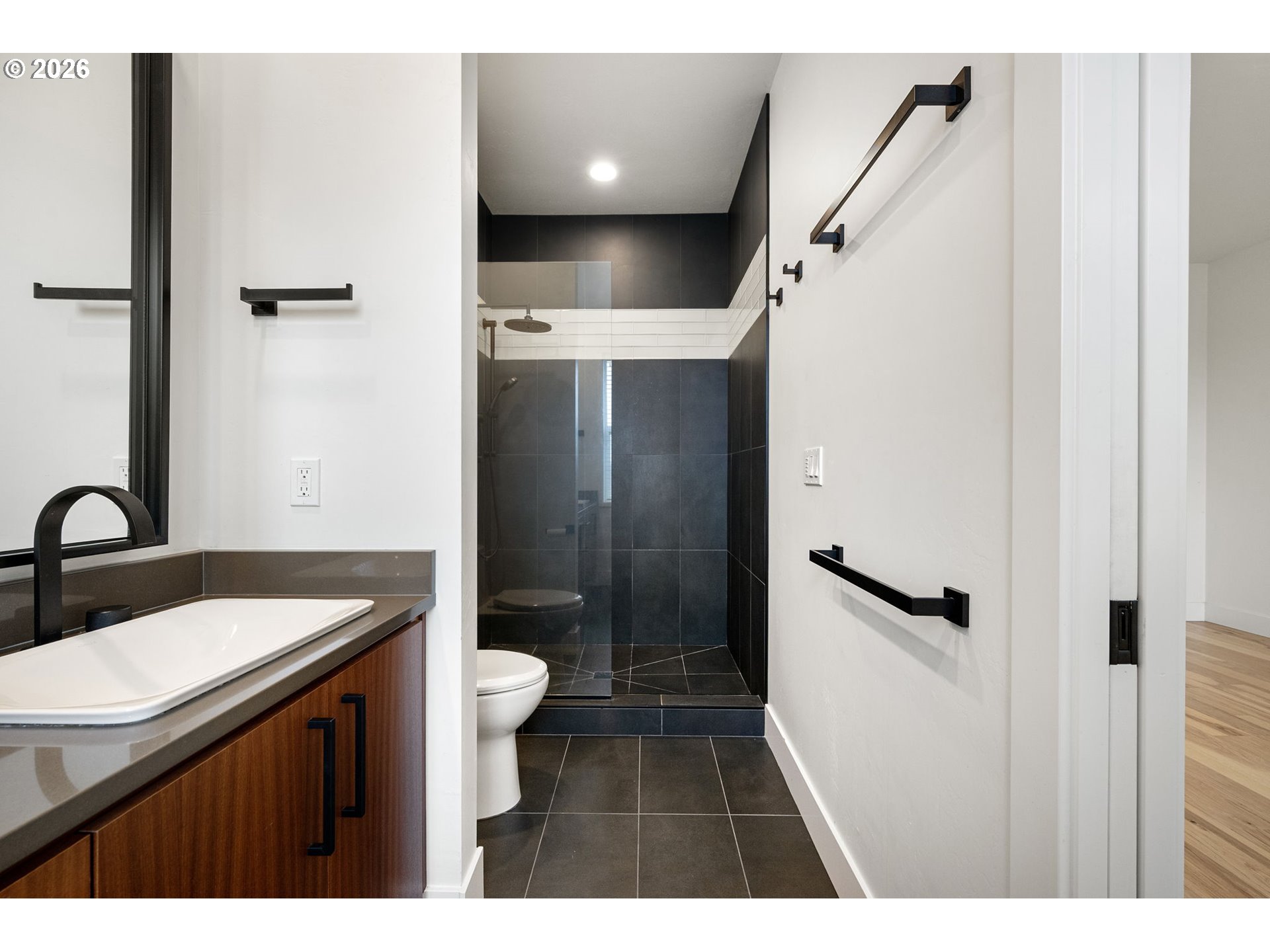 3340 Zane Lane Eugene, OR 97404 - Photo 16 of 37 a bathroom with a sink a toilet a mirror and shower