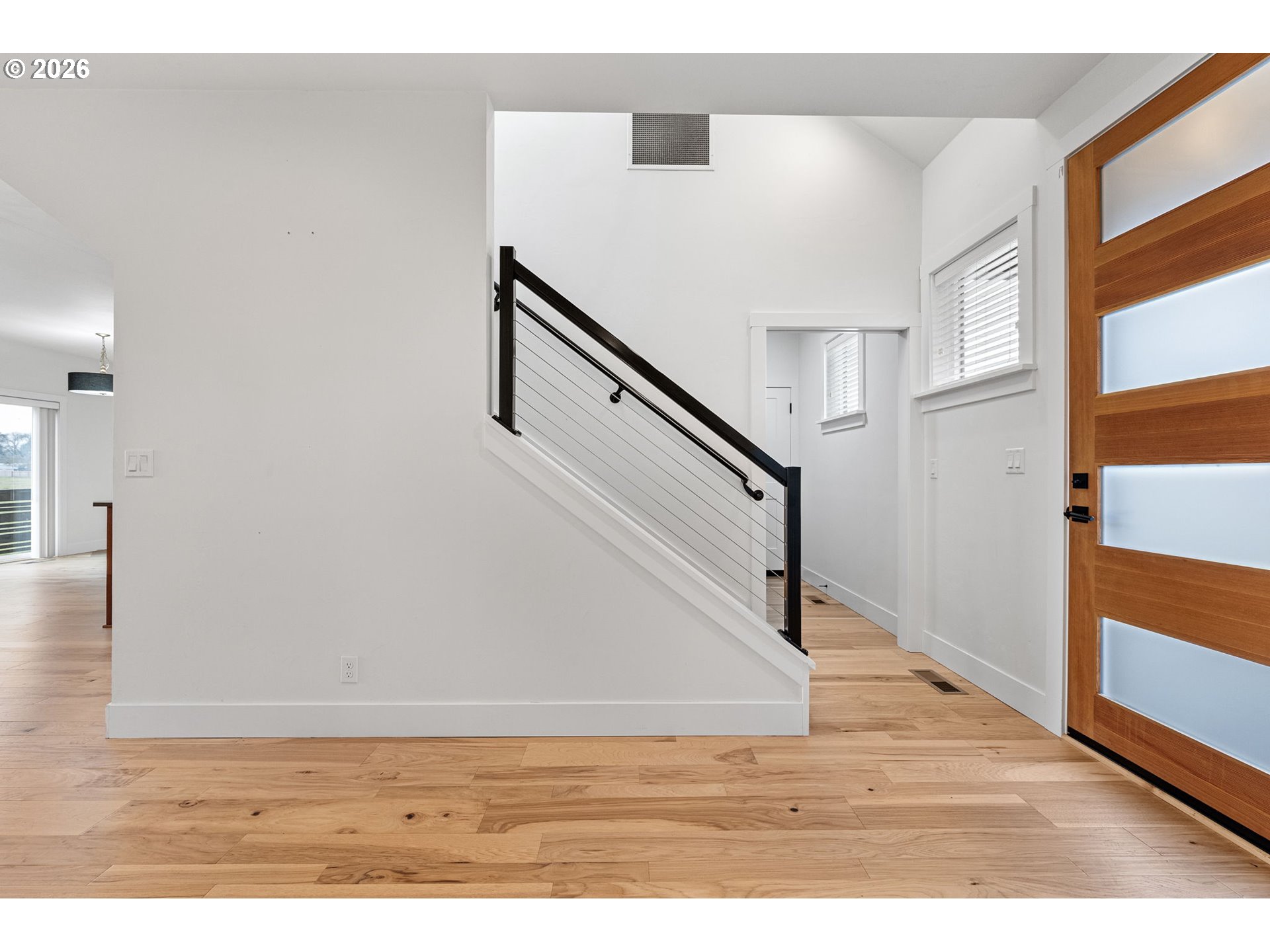 3340 Zane Lane Eugene, OR 97404 - Photo 17 of 37 a view of entryway and hall with wooden floor