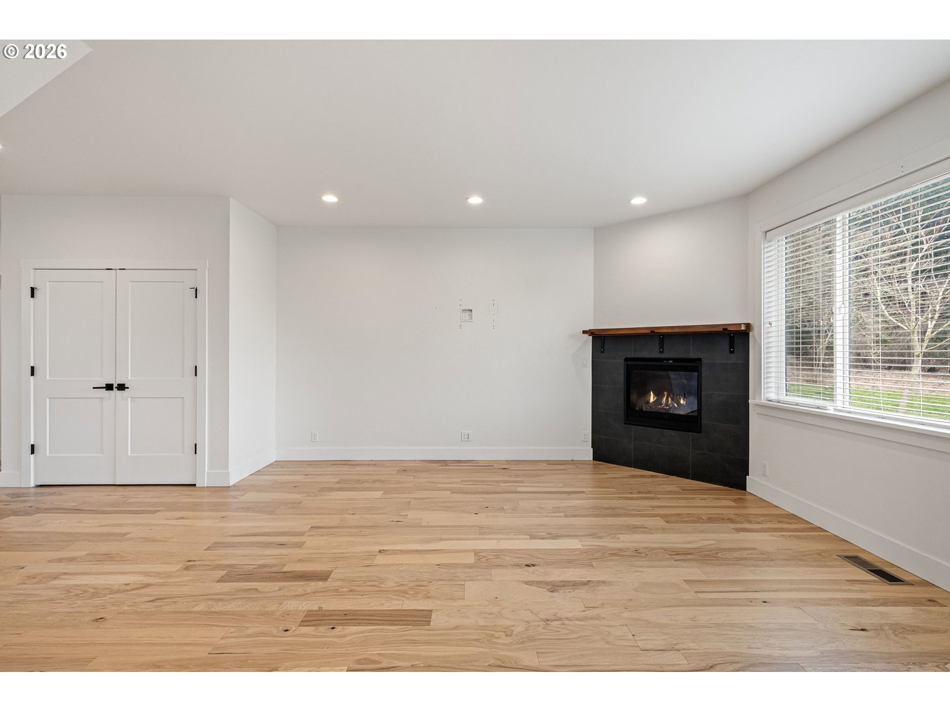 3340 Zane Lane Eugene, OR 97404 - Photo 21 of 37 a view of an empty room with wooden floor and a window