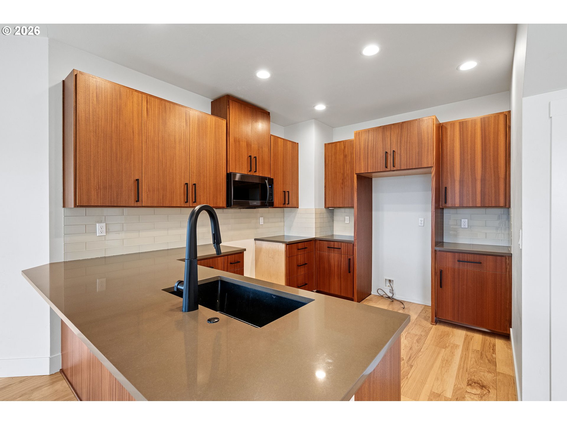 3340 Zane Lane Eugene, OR 97404 - Photo 22 of 37 a kitchen with stainless steel appliances a sink a stove a refrigerator cabinets and a counter top space