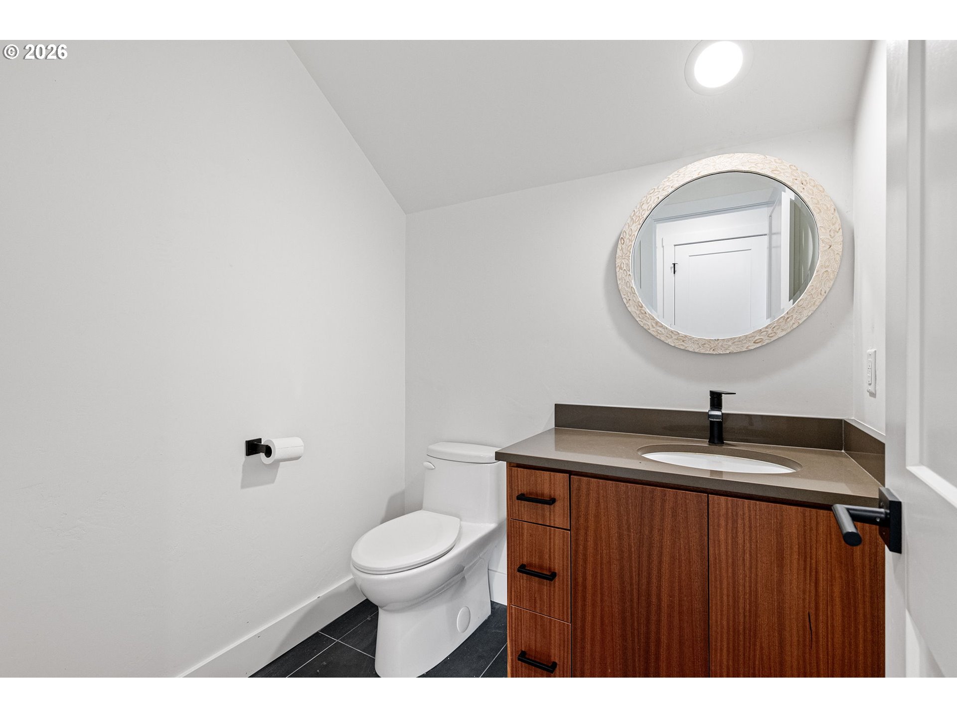 3340 Zane Lane Eugene, OR 97404 - Photo 31 of 37 a bathroom with a toilet a sink and mirror