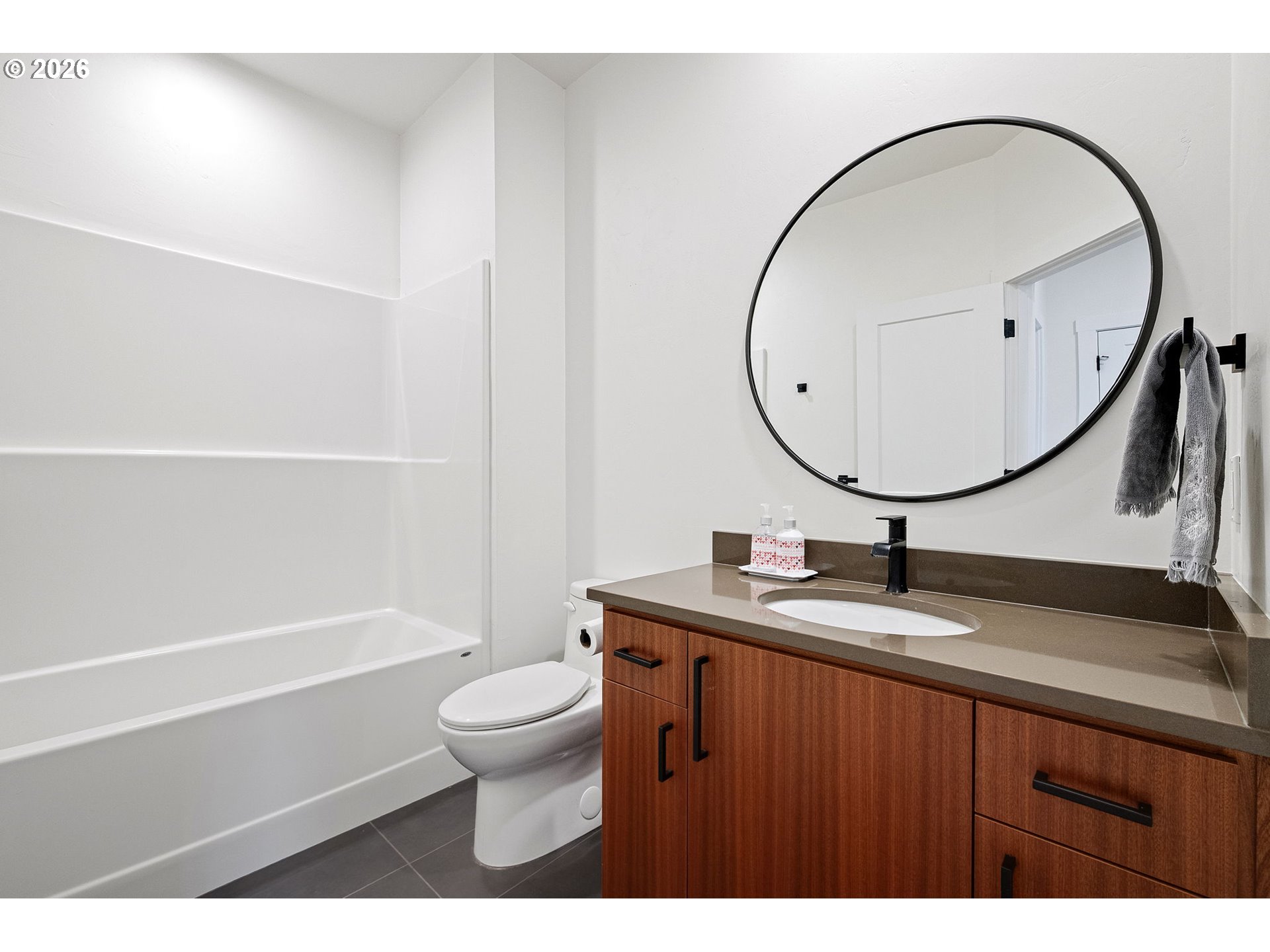 3340 Zane Lane Eugene, OR 97404 - Photo 9 of 37 a bathroom with a sink a toilet and a mirror