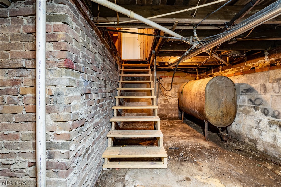 8729 Perrys Den Road Cumberland, OH 43732 - Photo 50 of 50 Basement featuring brick wall