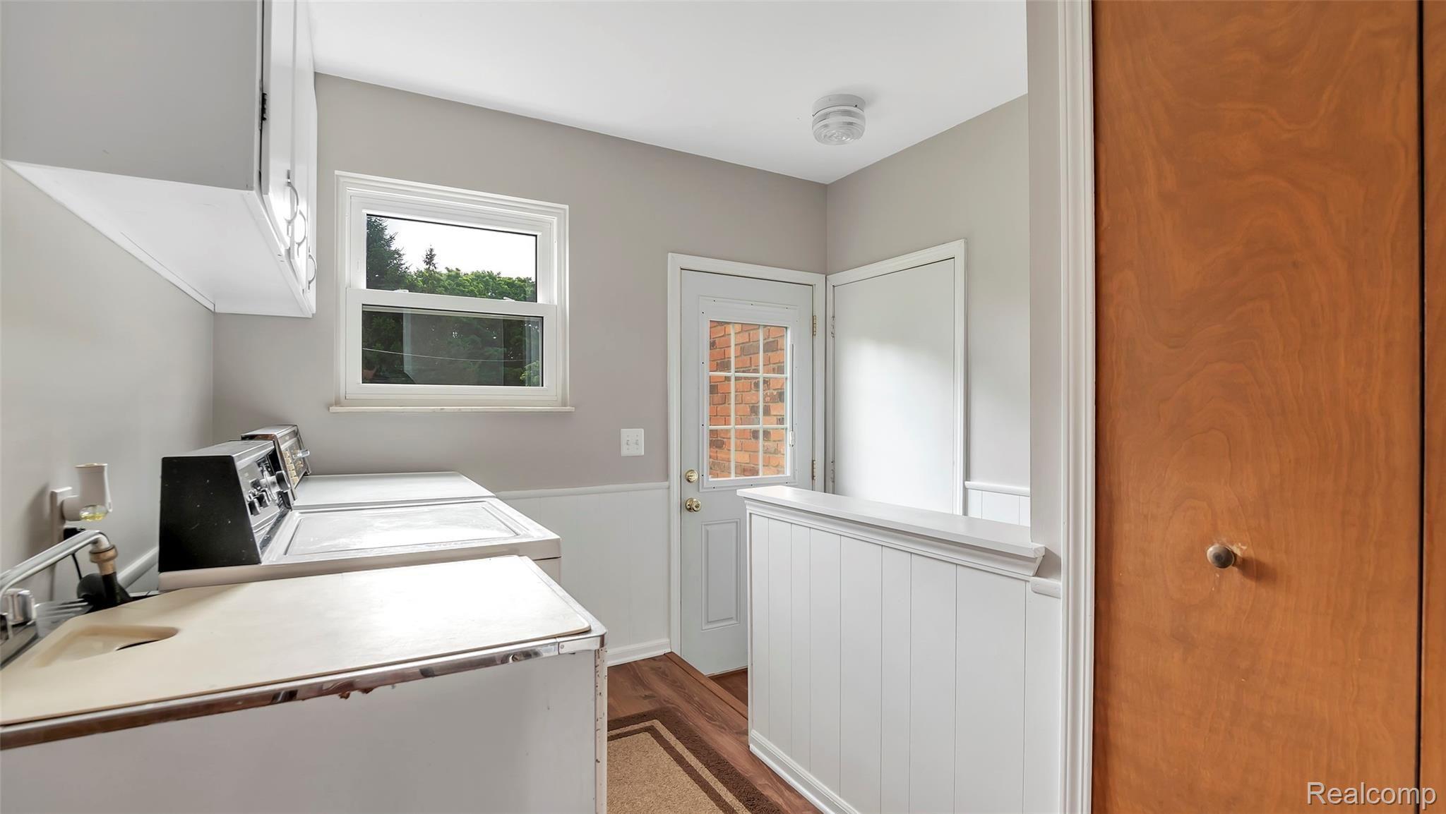 3485 West Rattalee Lake Road Holly, MI 48442 - Photo 25 of 46 Laundry room with door to access the outside.