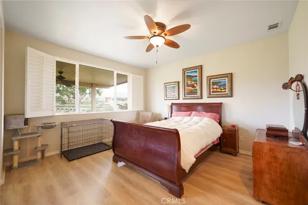 a bed room with a bed and a window