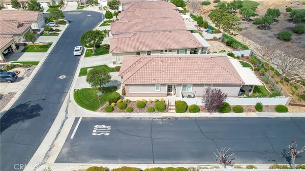 an aerial view of house with yard