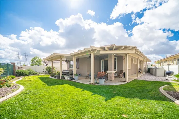 a view of a house with a yard porch and sitting area