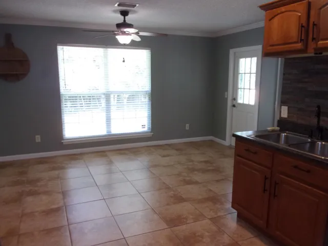 a view of an empty room with a window