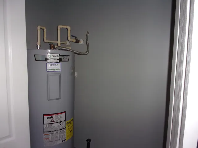 an empty room with wooden floor and closet