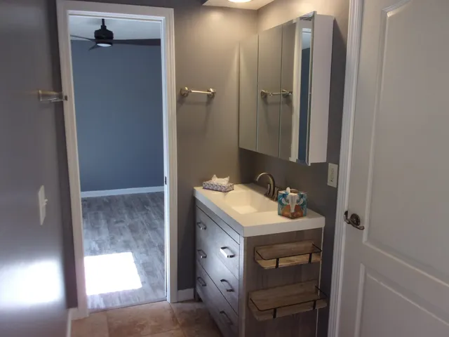 a bedroom with a bed and a dresser