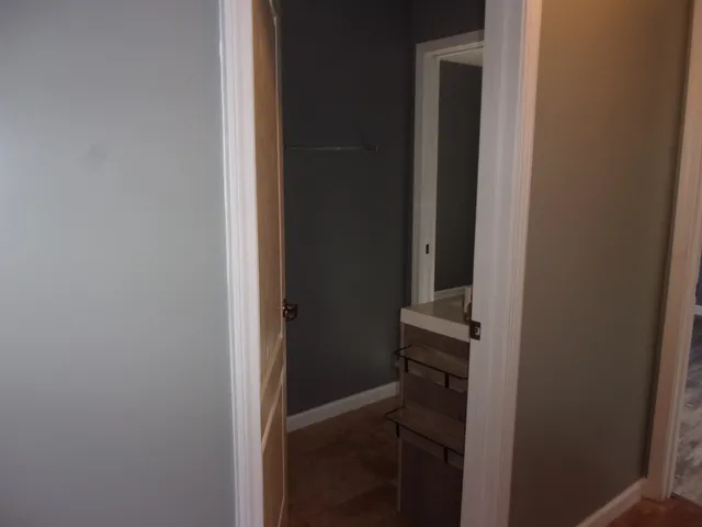 a spacious bathroom with a tub and a toilet