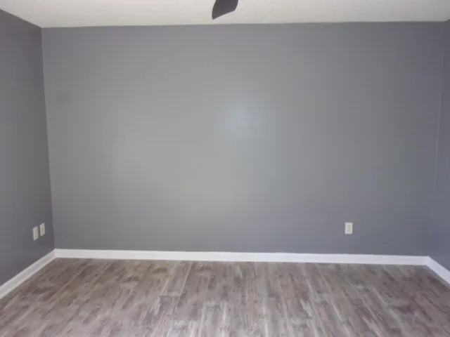 a bath tub sitting in a bathroom next to a window