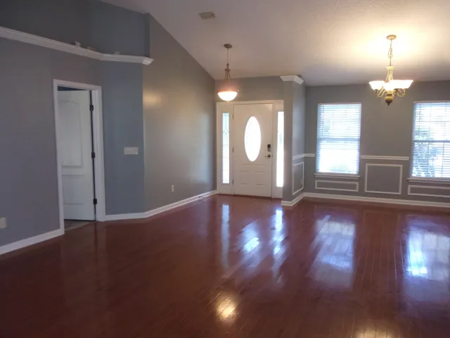 a view of a livingroom with wooden floor