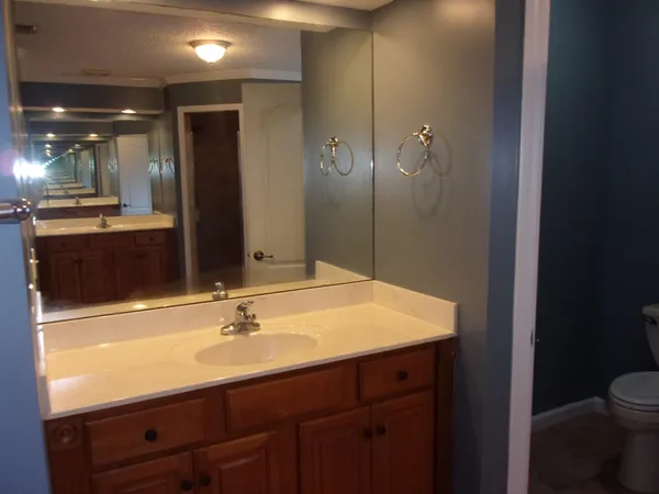 a view of a house with a large window and wooden floor