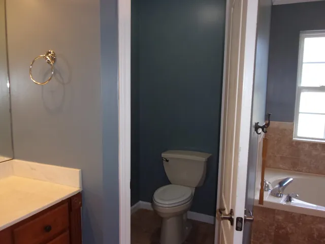 a view of a patio with a table chairs and backyard