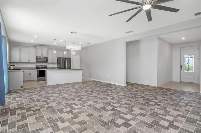 a view of a kitchen with a sink and cabinets