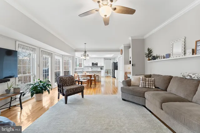 a work room with furniture and a wooden floor