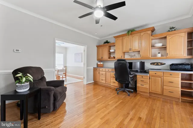 a view of an entryway with wooden floor