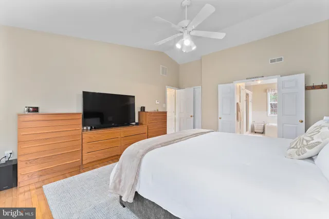 a bedroom with furniture and a book shelf