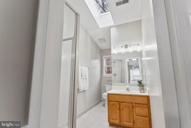 a bedroom with a bed a chair and couch