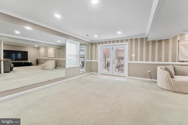 a view of a patio with a table and chairs under an umbrella
