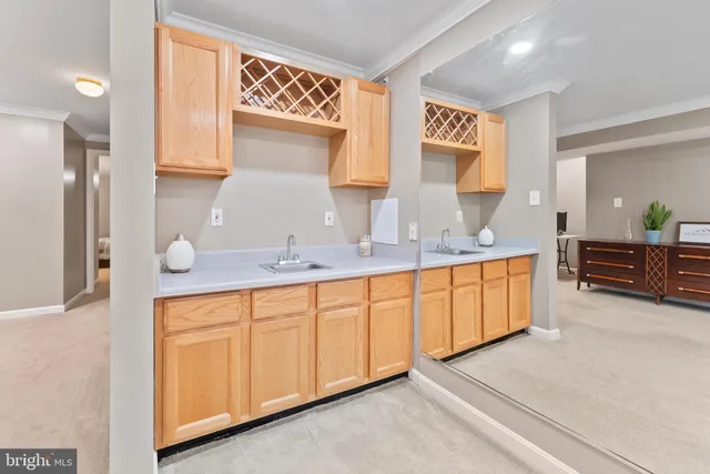a view of a patio with a table and chairs under an umbrella