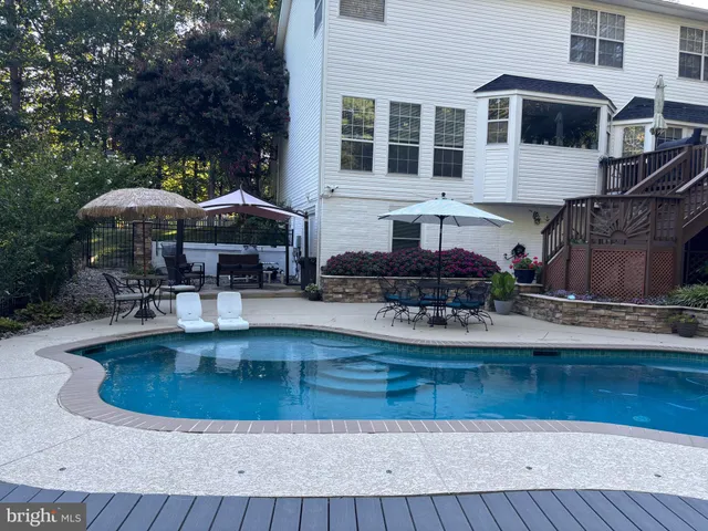 a view of a balcony with chairs