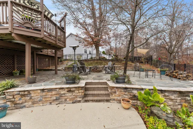 an aerial view of a house with outdoor space