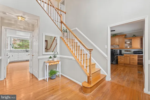 a kitchen with granite countertop a stove top oven sink and window