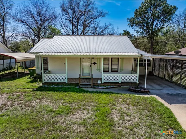 a view of a house with a yard patio and a patio