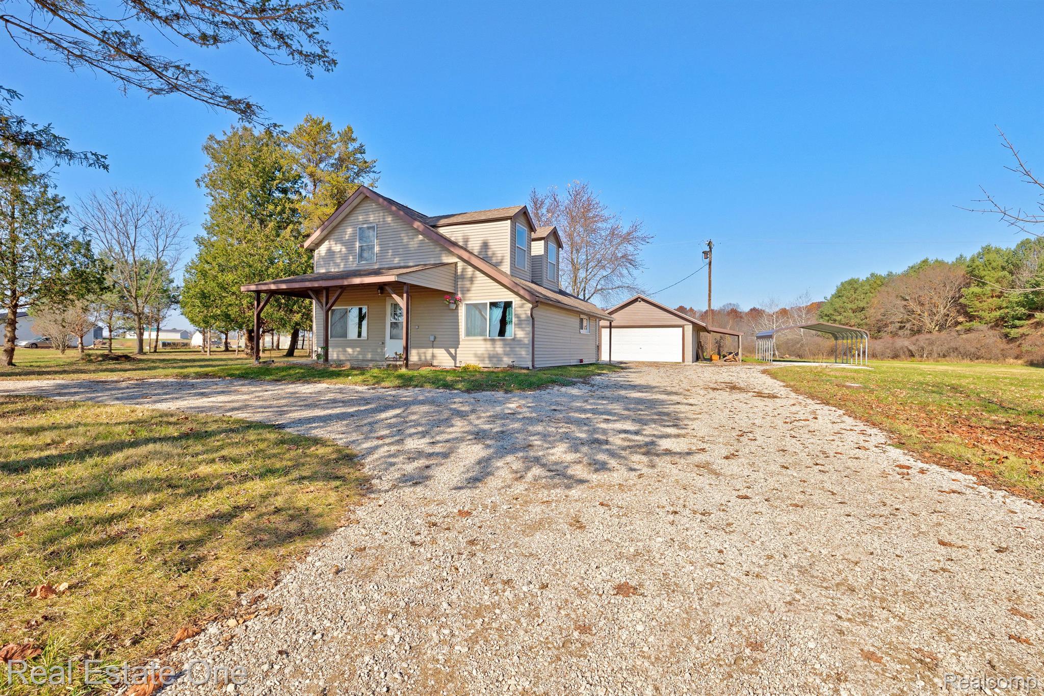 Side view of House, 2 Car Garage & Carport