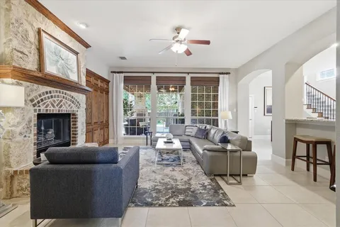 a living room with furniture a rug and a chandelier