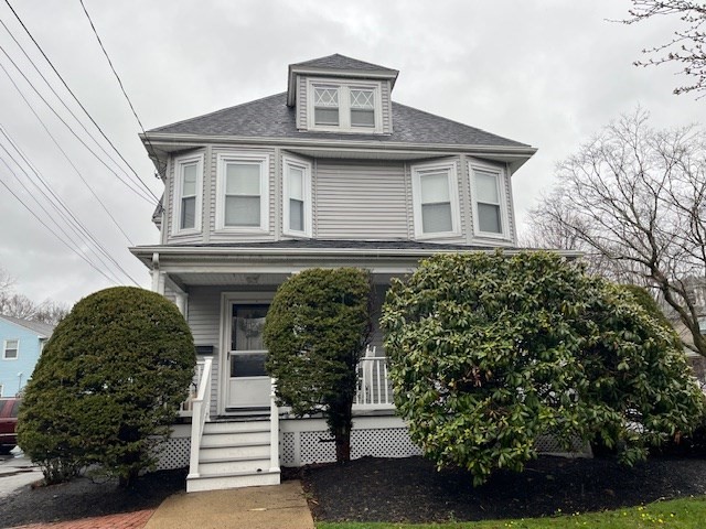 7 Lowell Street, Unit A Woburn, MA 01801 - Photo 3 of 17 a front view of a house with a garden