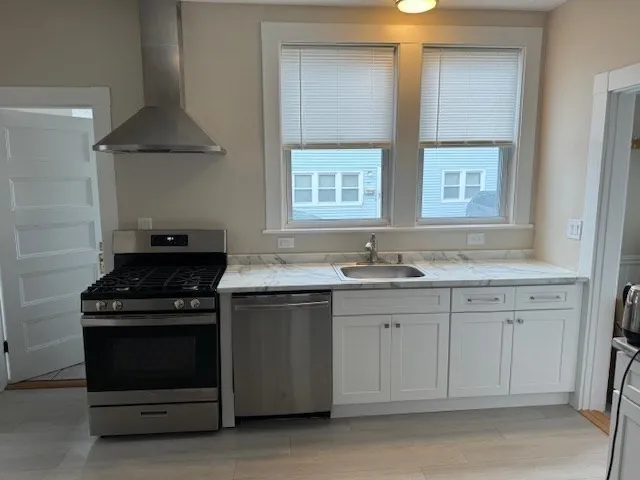 a kitchen with a stove and a sink