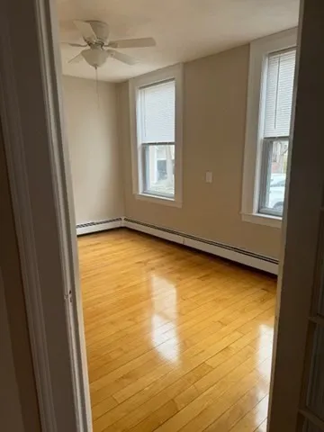 a view of an empty room with a window