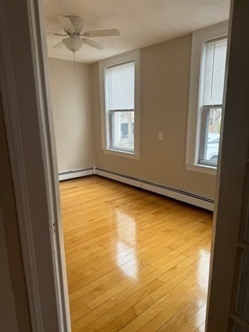 7 Lowell Street, Unit A Woburn, MA 01801 - Photo 9 of 17 a view of an empty room with a window