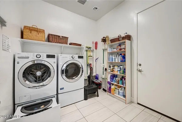 a view of a storage & utility room with washer and dryer