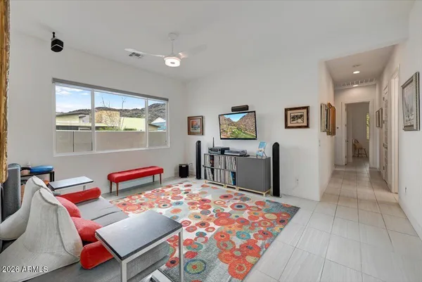 a bedroom with a bed a desk and chair