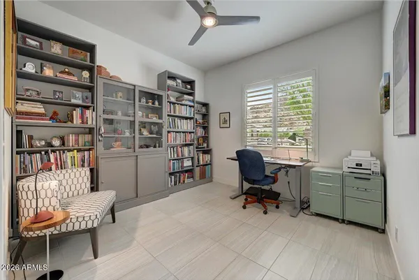 a view of a livingroom with workspace and a couch