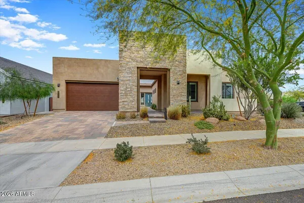 front view of a house with a yard