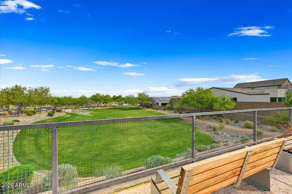a view of a chair and table in the garden