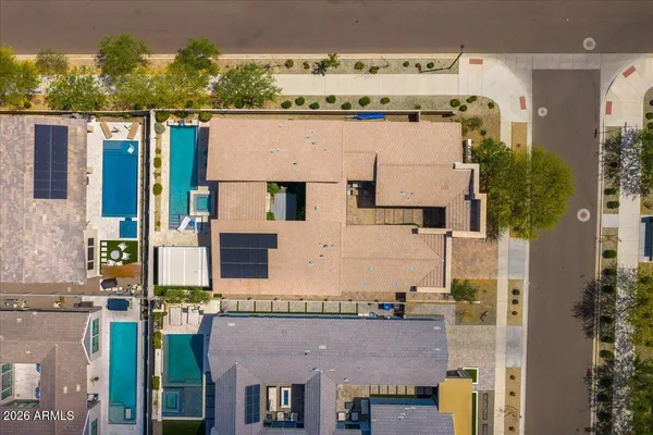 an aerial view of a house with a ocean view